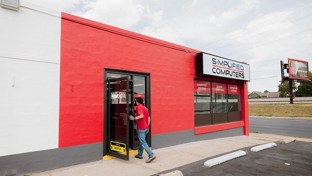 Exterior of Simplified Computers storefront offering computer repair and tech services.