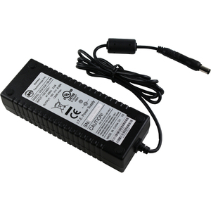 A black rectangular notebook adapter is shown with its attached cable coiled and secured, positioned diagonally on a white background.