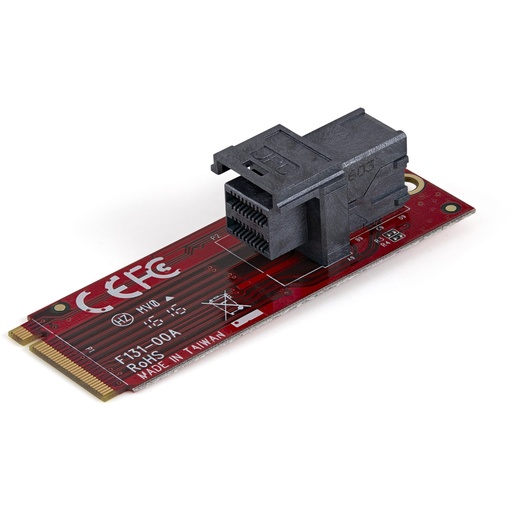 A small, rectangular red circuit board features a black multi-pin connector mounted near one end, with gold contacts on the opposite end, presented on a white background.