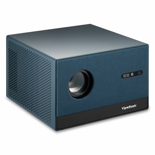 A compact, rectangular blue-grey projector with a large lens and textured front panel is angled, showing its perforated side grille, on a white background.